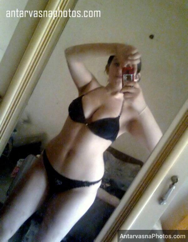 Excited girlfriend taking her own nude selfie